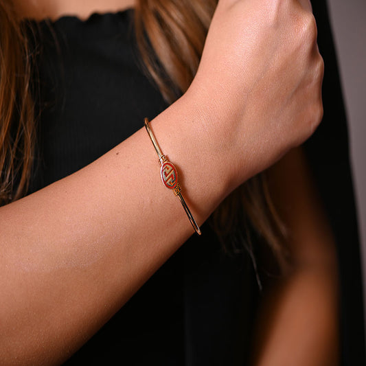 أسورة ذهب عيار 18 بعنصر ملون هندسي