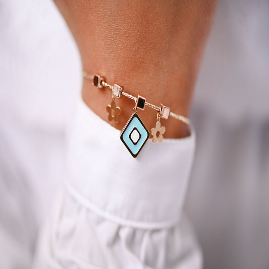 أسورة ذهب عيار 18 اطفال بأشكال هندسية باللون التركواز