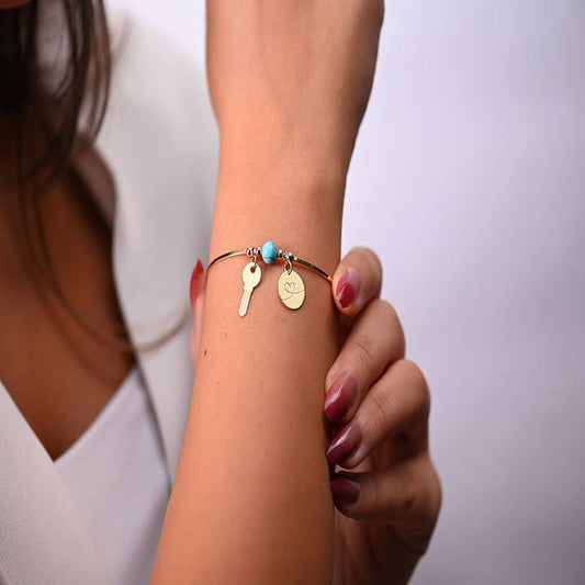 أسورة ذهب عيار 18 بتعليقة مفتاح