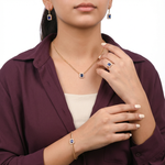 طقم ذهب عيار 18 بسلسلة حلقات وحجر أزرق - Ghamieh