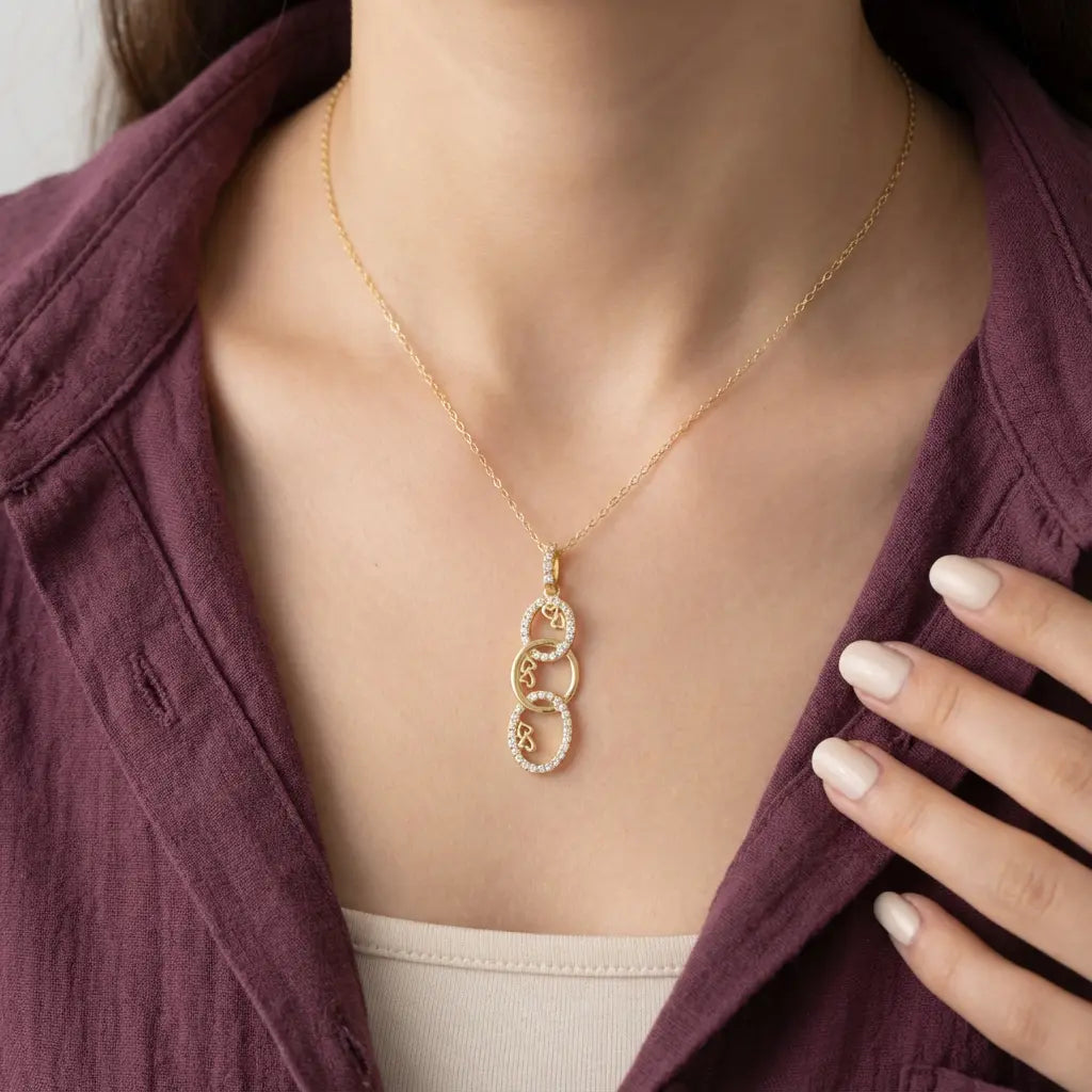 تعليقة ذهب عيار 18 بتصميم حلقات ثلاثية - Ghamieh