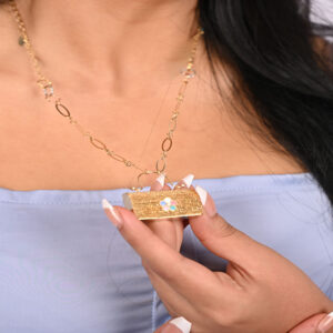 Gold necklace in the shape of a bag